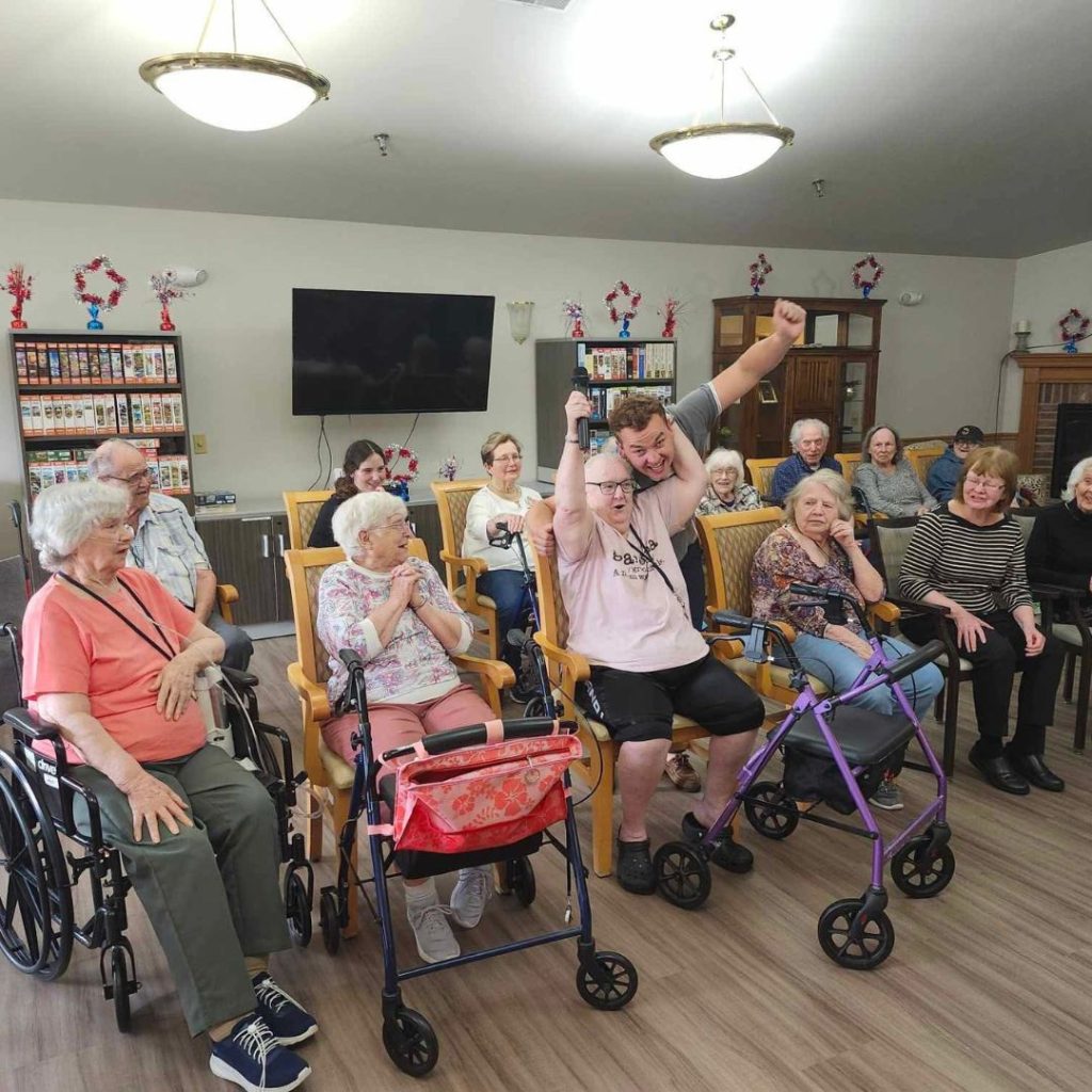 Zach celebrates his win with residents