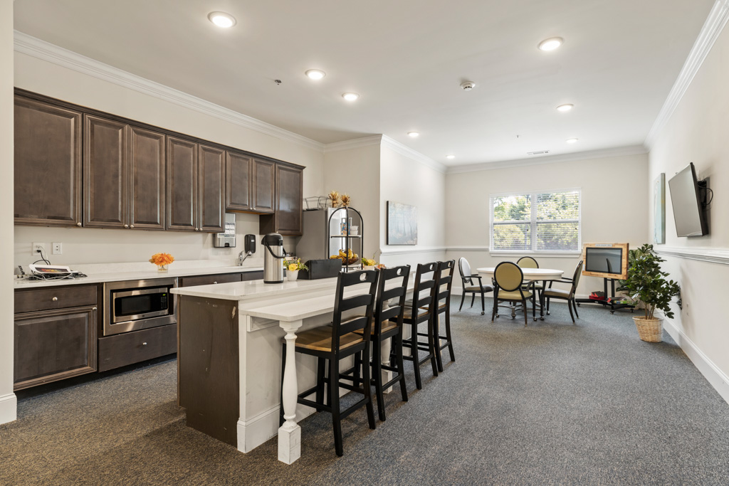 Modern community kitchen at The Addison of Alpharetta senior living.