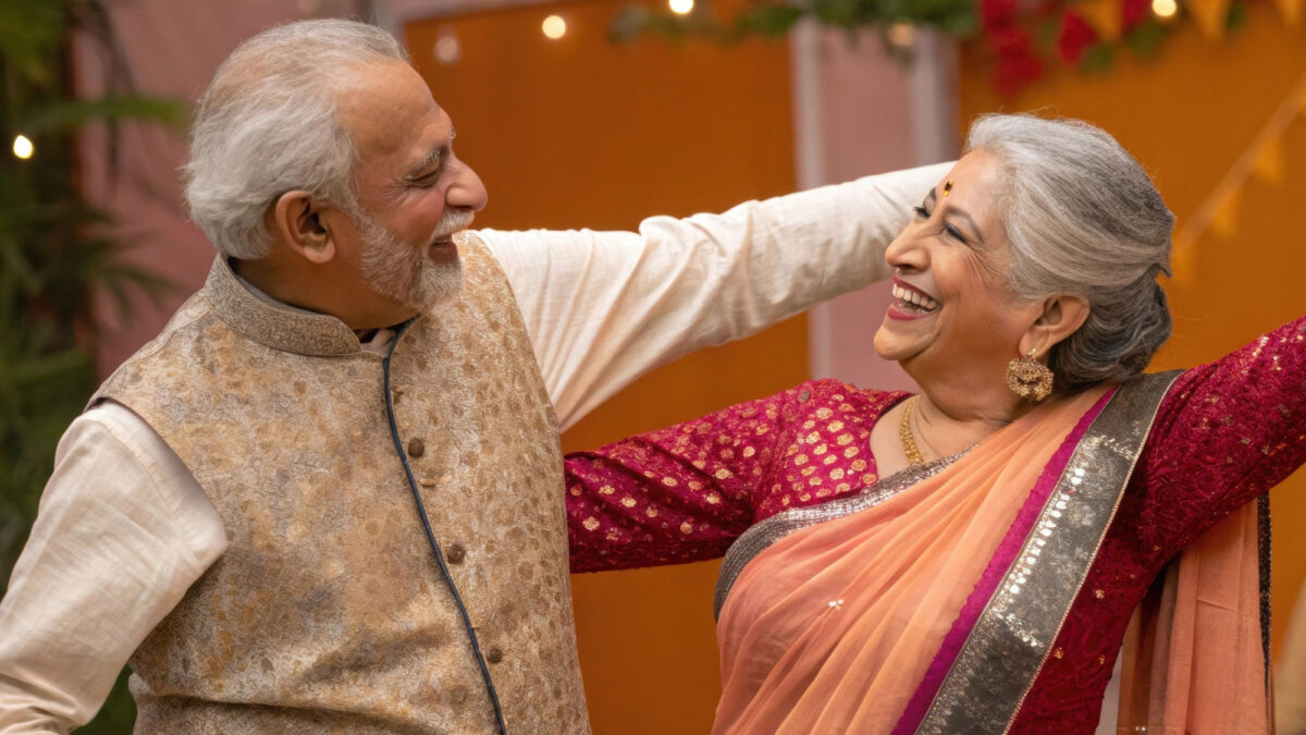 Elderly Indian couple dance at an event